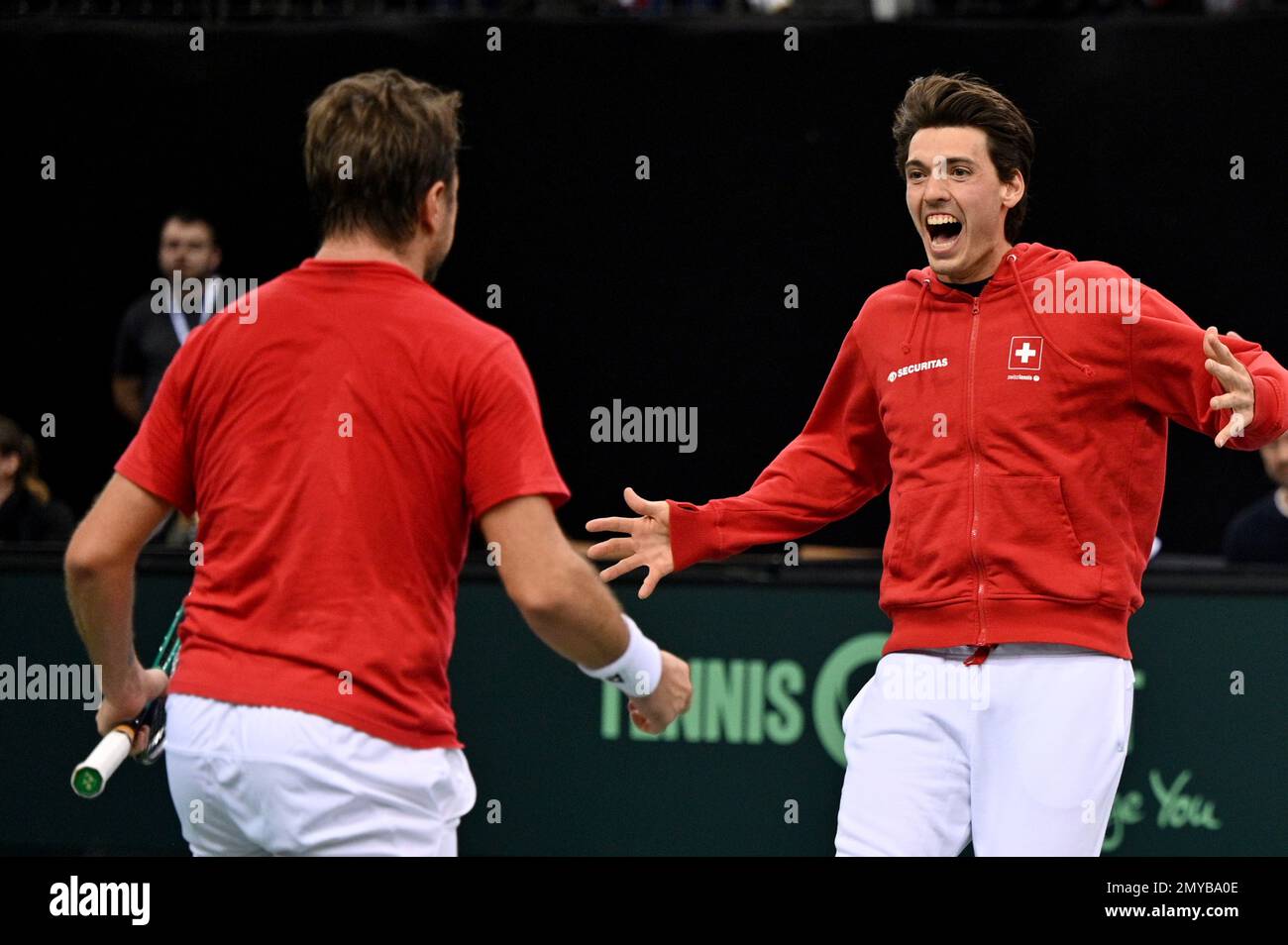 Trier, Germany. 04th Feb, 2023. Tennis, Men: Davis Cup - Qualifying Round,  Qualifying, Germany - Switzerland; Singles; Switzerland's Stan Wawrinka (l)  is celebrated by teammate Marc-Andrea Hüsler after his win against Germany's