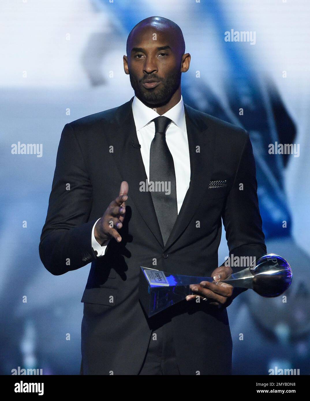 Former NBA basketball player Kobe Bryant accepts the icon award at the