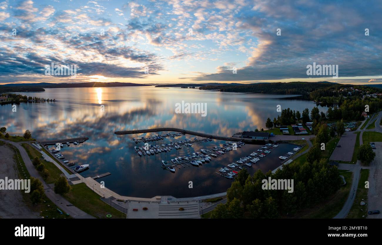 Sunset at a lake and a town in Sweden Stock Photo