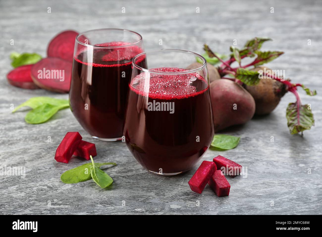Freshly made beet juice on grey table Stock Photo