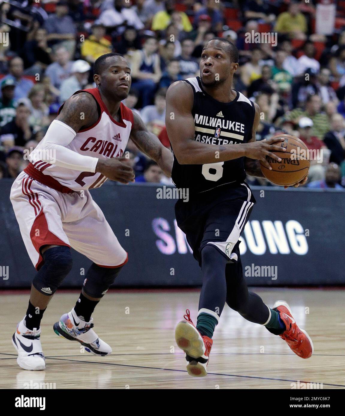 Milwaukee Bucks' Ra'Shad James, right drives by Cleveland Cavaliers' Kay  Felder during the first half of an NBA summer league basketball  game,Friday, July 8, 2016, in Las Vegas. (AP Photo/John Locher Stock