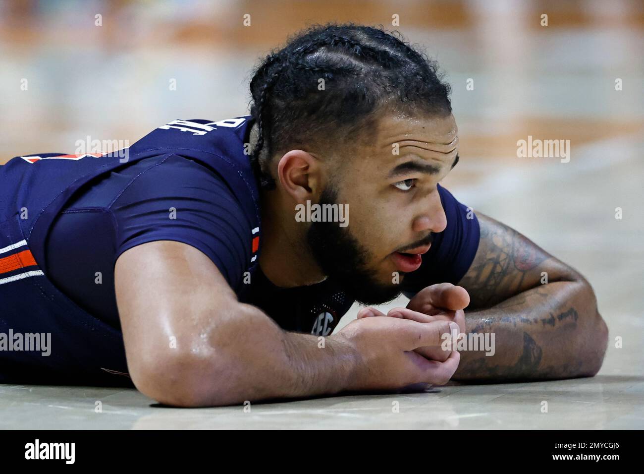 Auburn forward Johni Broome holds hands under his mouth after a