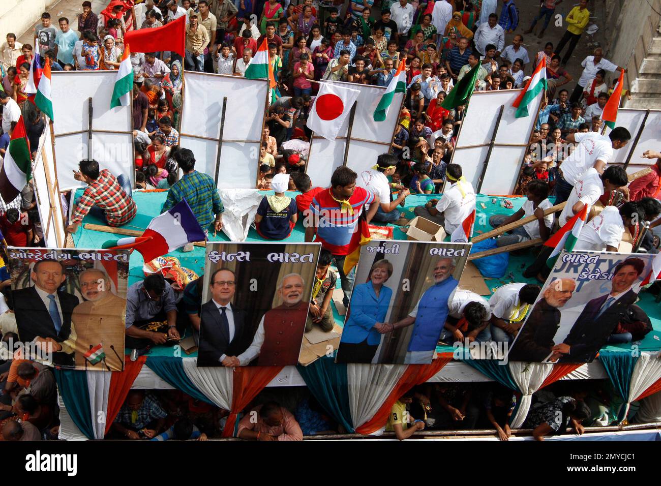 A tableau carries portraits of Indian Prime Minister Narendra Modi with ...
