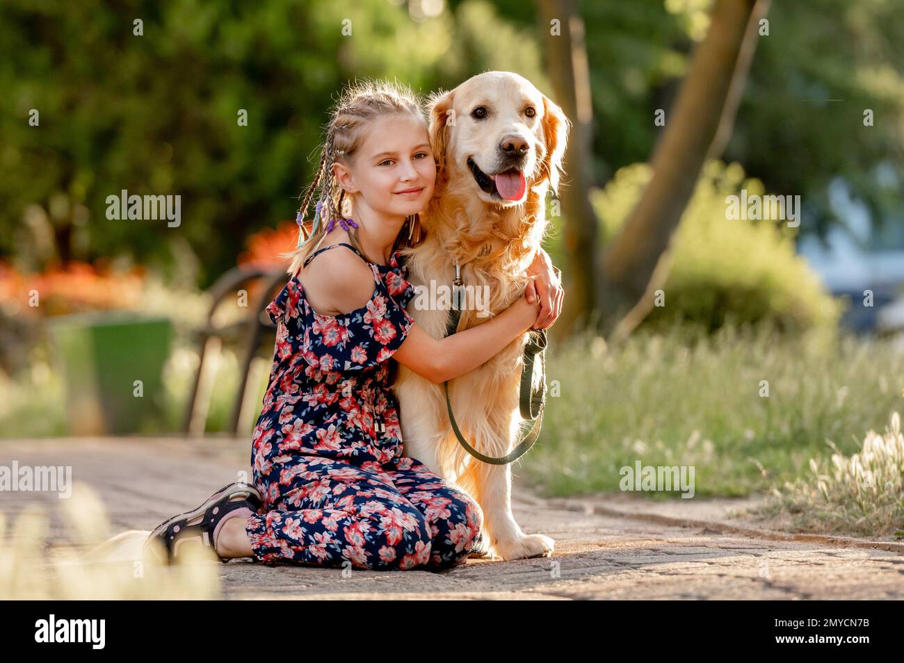 Girl and golden retriever dog Stock Photo - Alamy