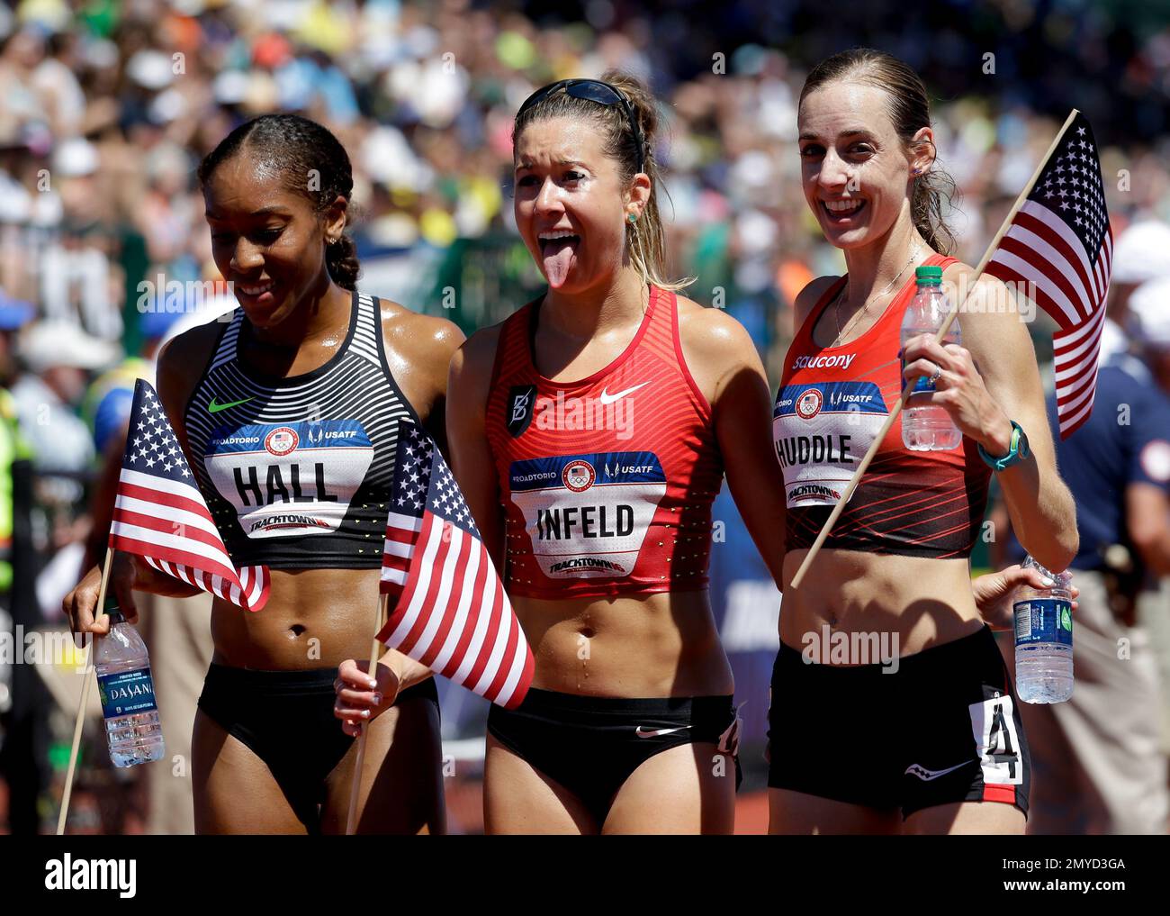 Molly Huddle, winner, right, Emily Infeld, second place, center, and ...