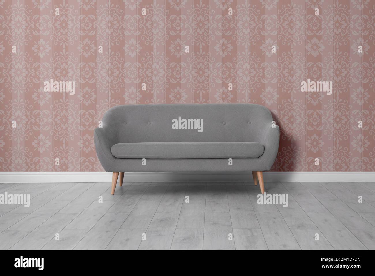 Modern sofa near patterned wallpapers. Interior design Stock Photo