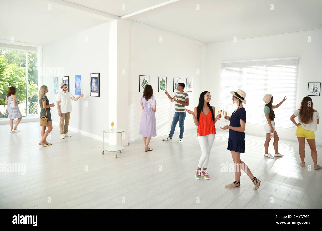 Group of people at exhibition in art gallery Stock Photo - Alamy