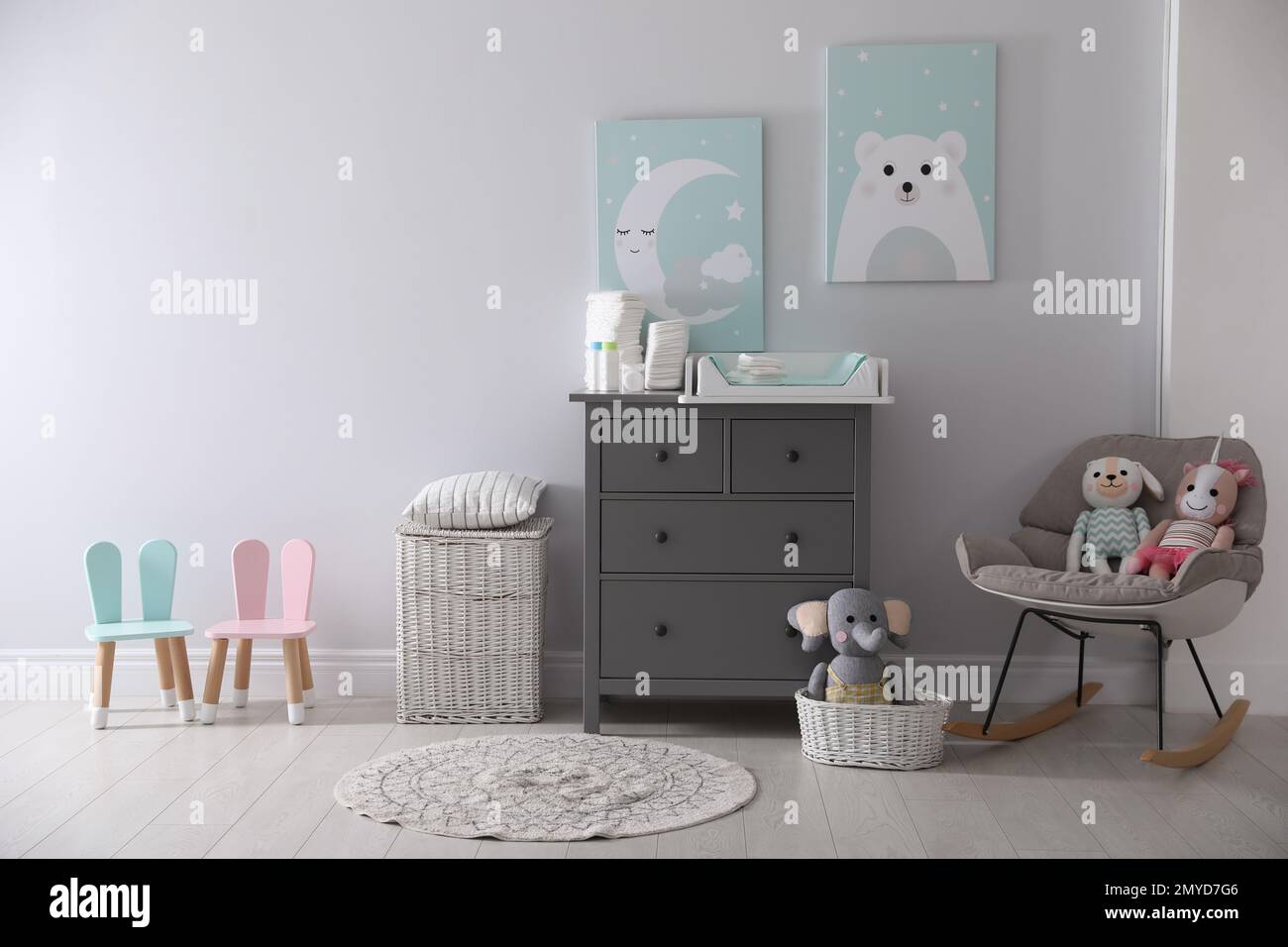 Chest of drawers with changing tray and pad in baby room. Interior ...