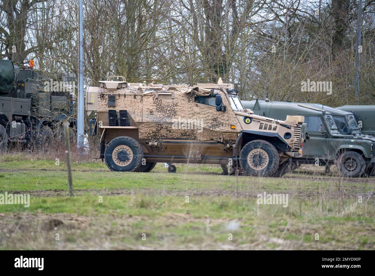 British army Foxhound protected patrol vehicle next top Defender wolf Stock Photo