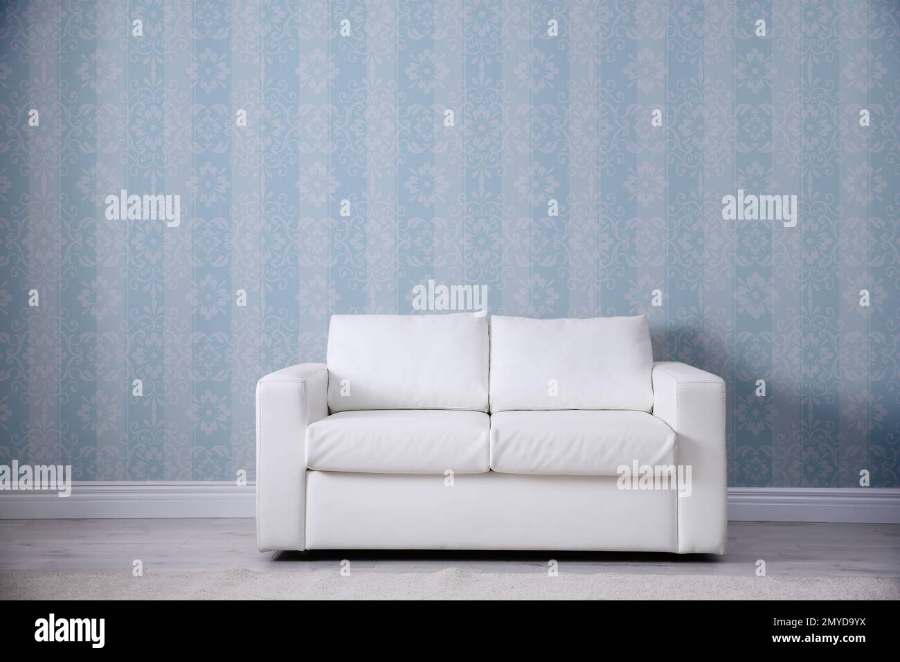 Modern sofa near patterned wallpapers. Interior design Stock Photo Alamy
