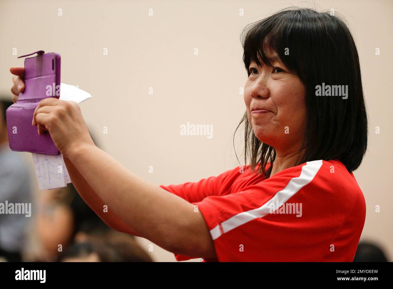 In this June 18, 2016, photo, former table tennis Olympian Lily Yip