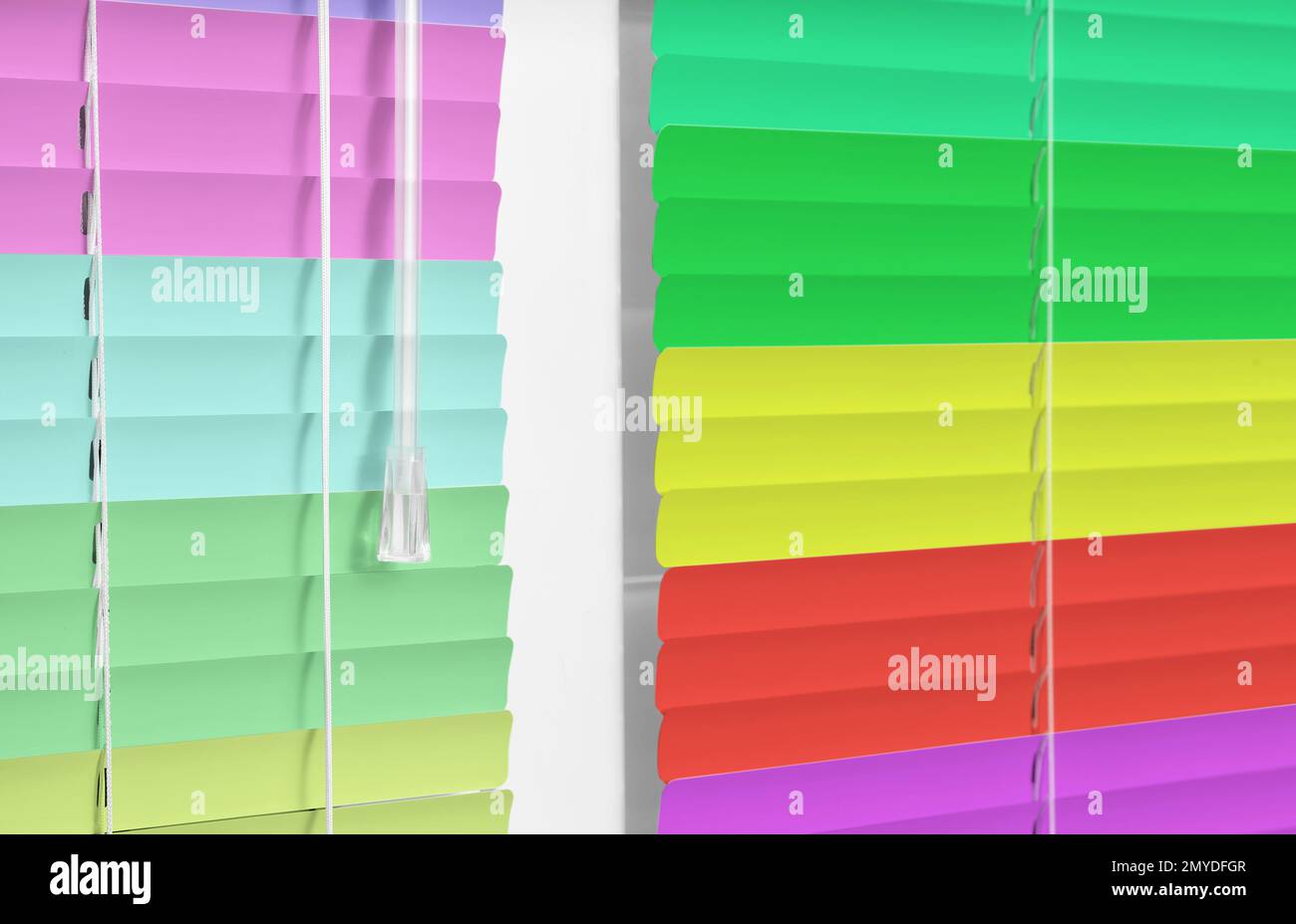 Closed multicolor window blinds as background, closeup view Stock Photo