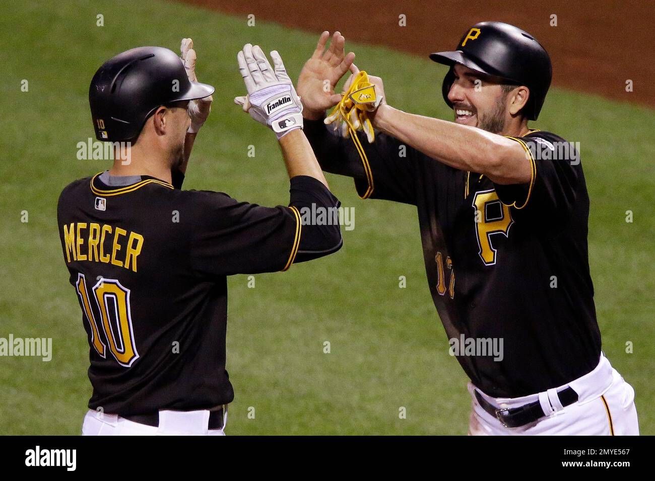 Pittsburgh Pirates' Jordy Mercer (10) celebrates with teammate