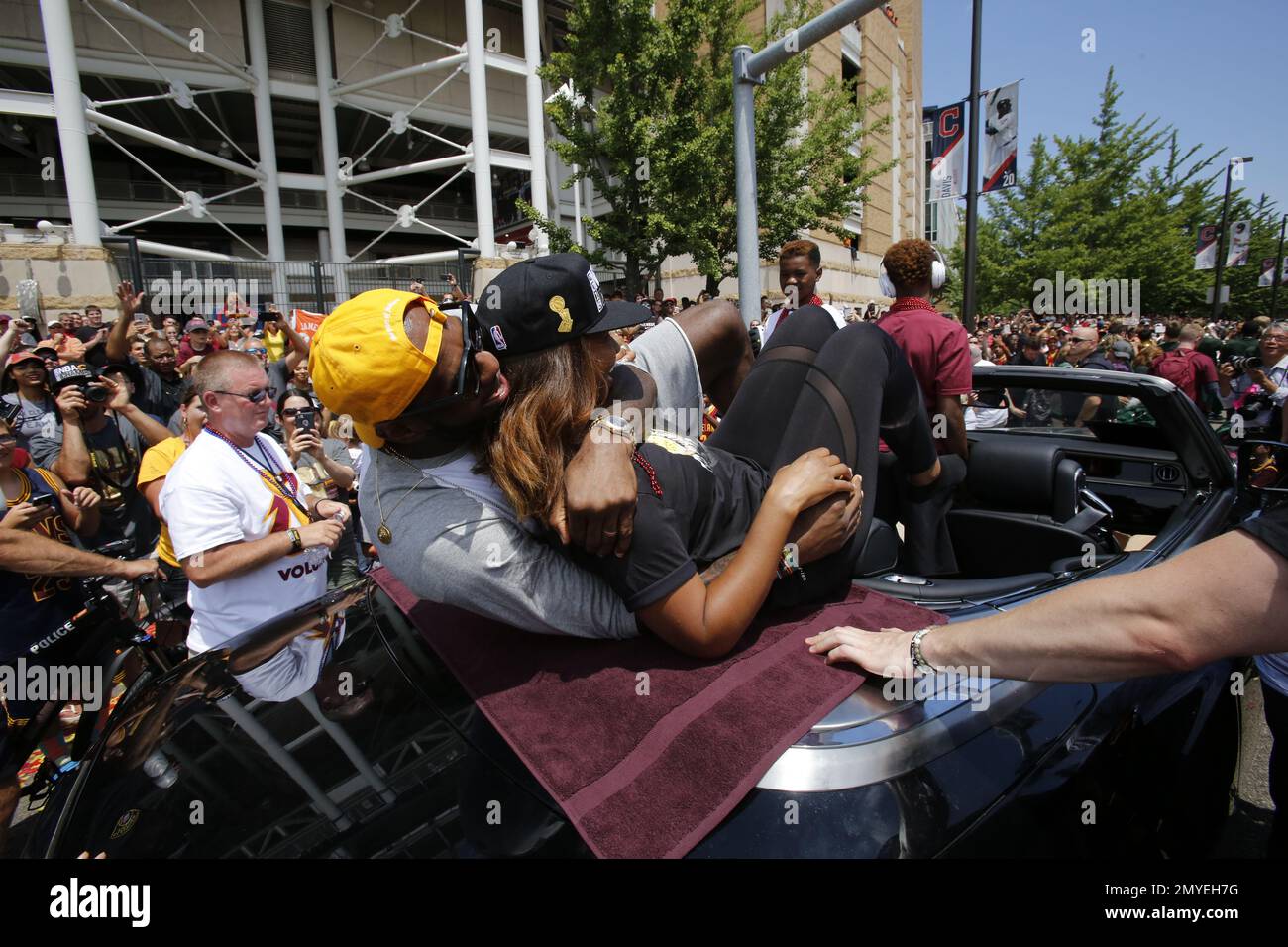Cleveland Cavaliers' LeBron James, left, playfully hugs his wife ...