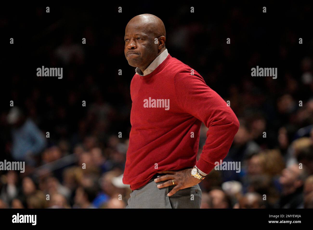 St. John's head coach Mike Anderson stands next to the bench during the