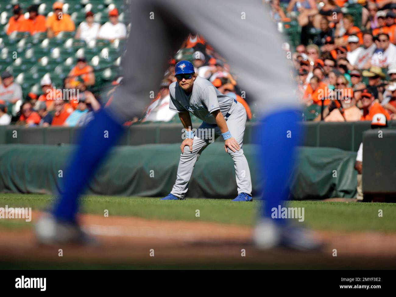 Toronto Blue Jays first base coach Tim Leiper watches Toronto's Kevin