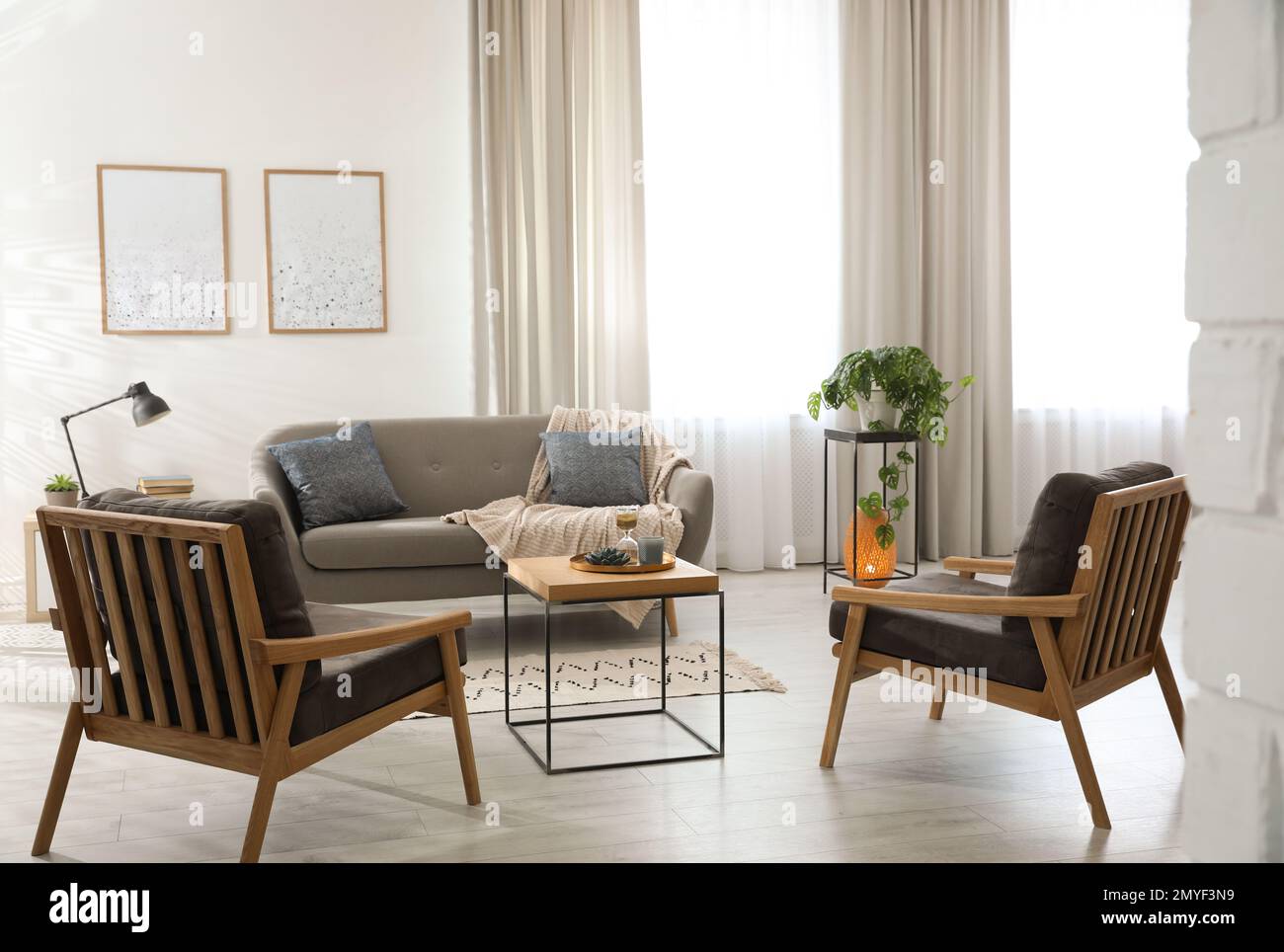 Modern living room interior with comfortable sofa and armchairs Stock ...