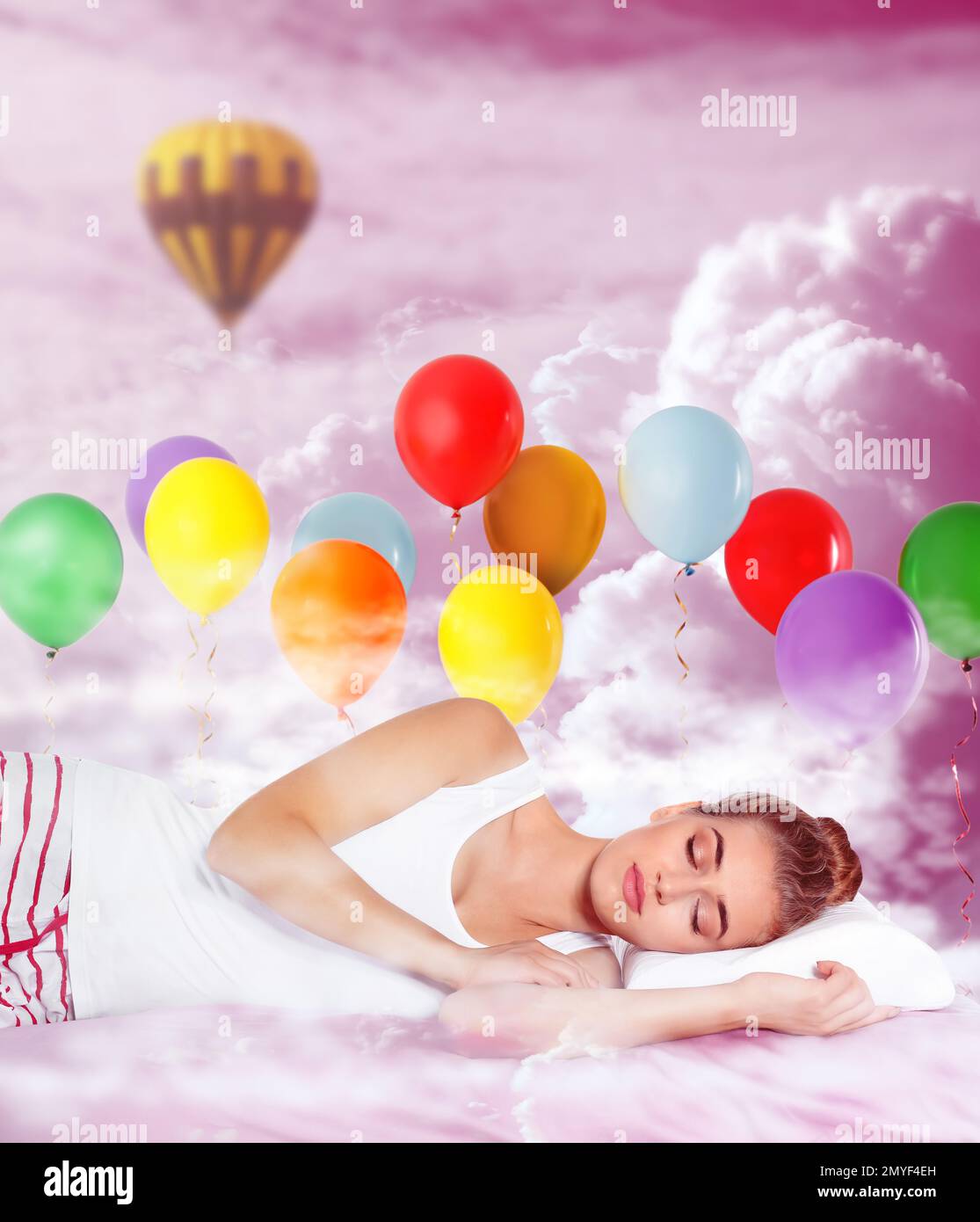 Sweet dreams. Pink cloudy sky with bright air balloons around sleeping ...