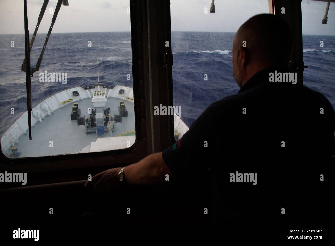 Captain Alex Moroz looks out of the window on the bridge of the ...