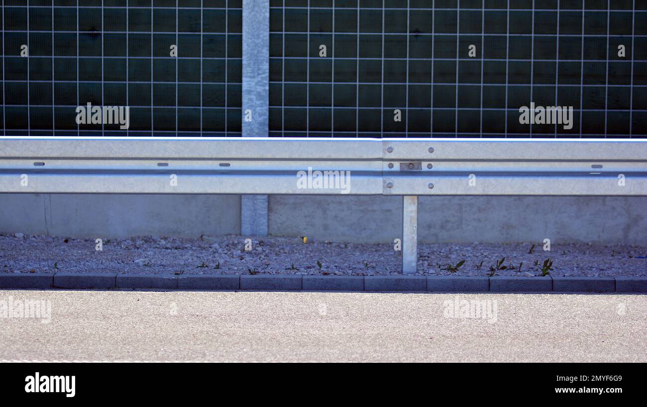 Safety barriers on the highway. Anodized safety steel barrier on