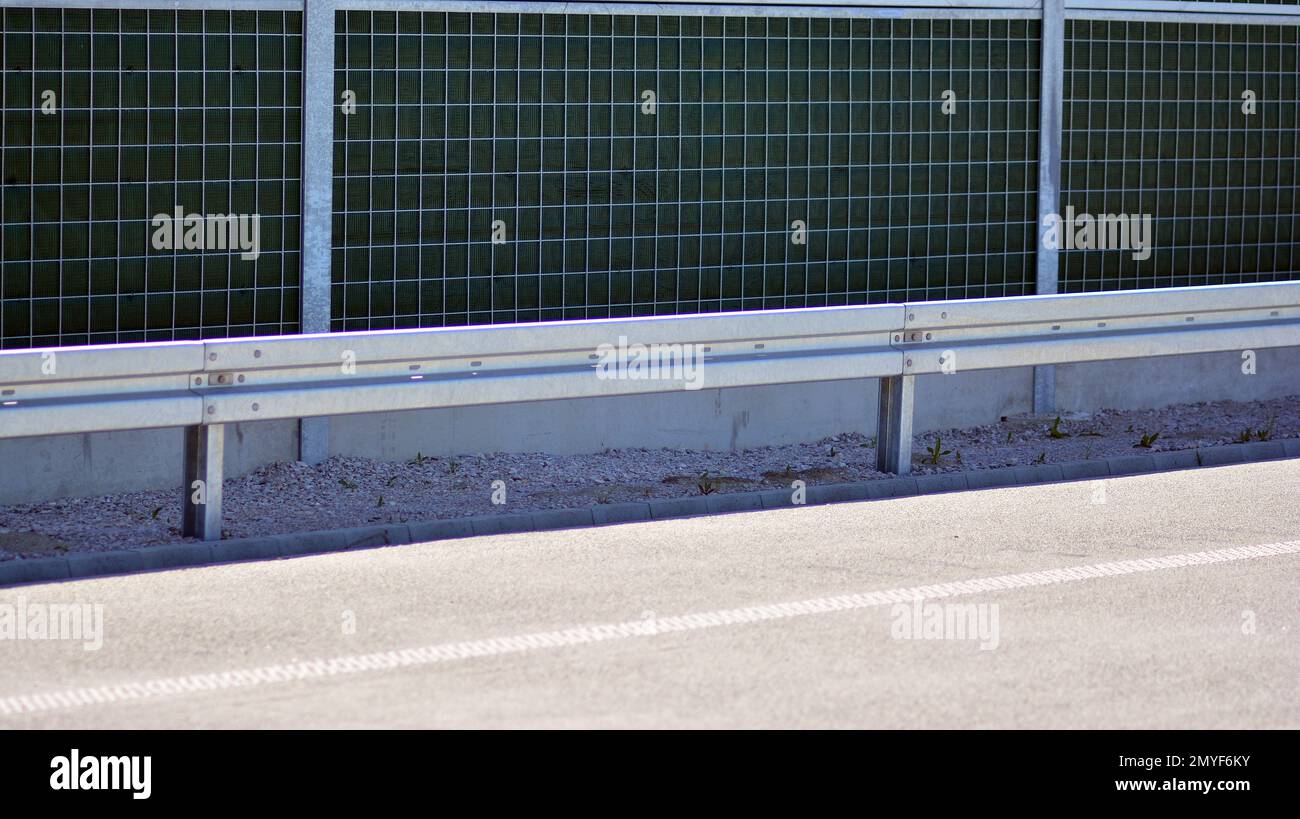 Safety barriers on the highway. Anodized safety steel barrier on