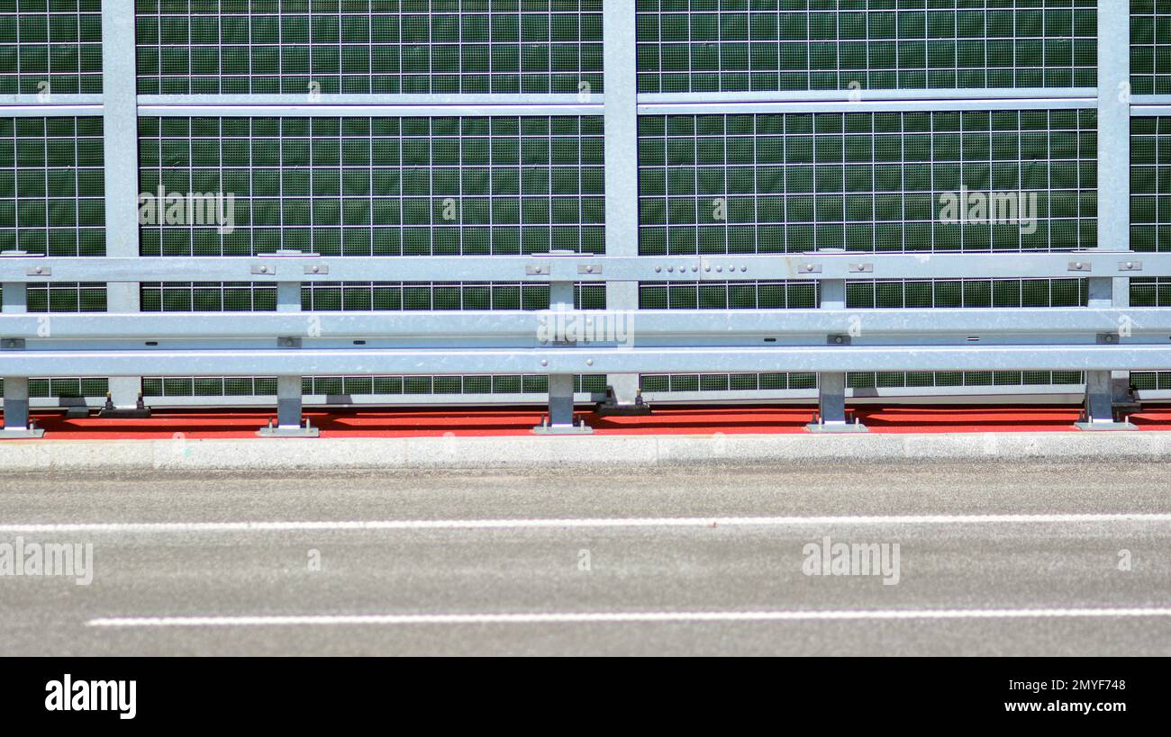 Safety barriers on the highway. Anodized safety steel barrier on