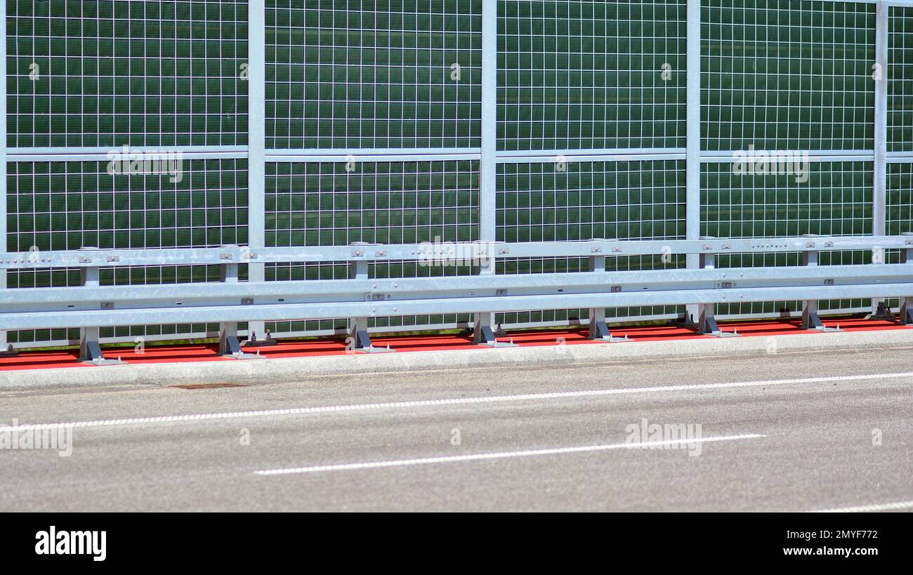 Safety barriers on the highway. Anodized safety steel barrier on