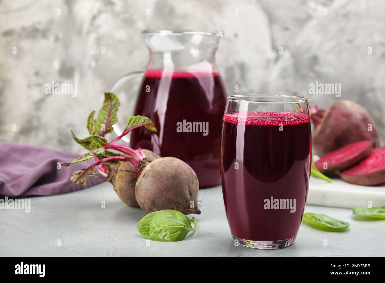 Freshly made beet juice on grey table Stock Photo