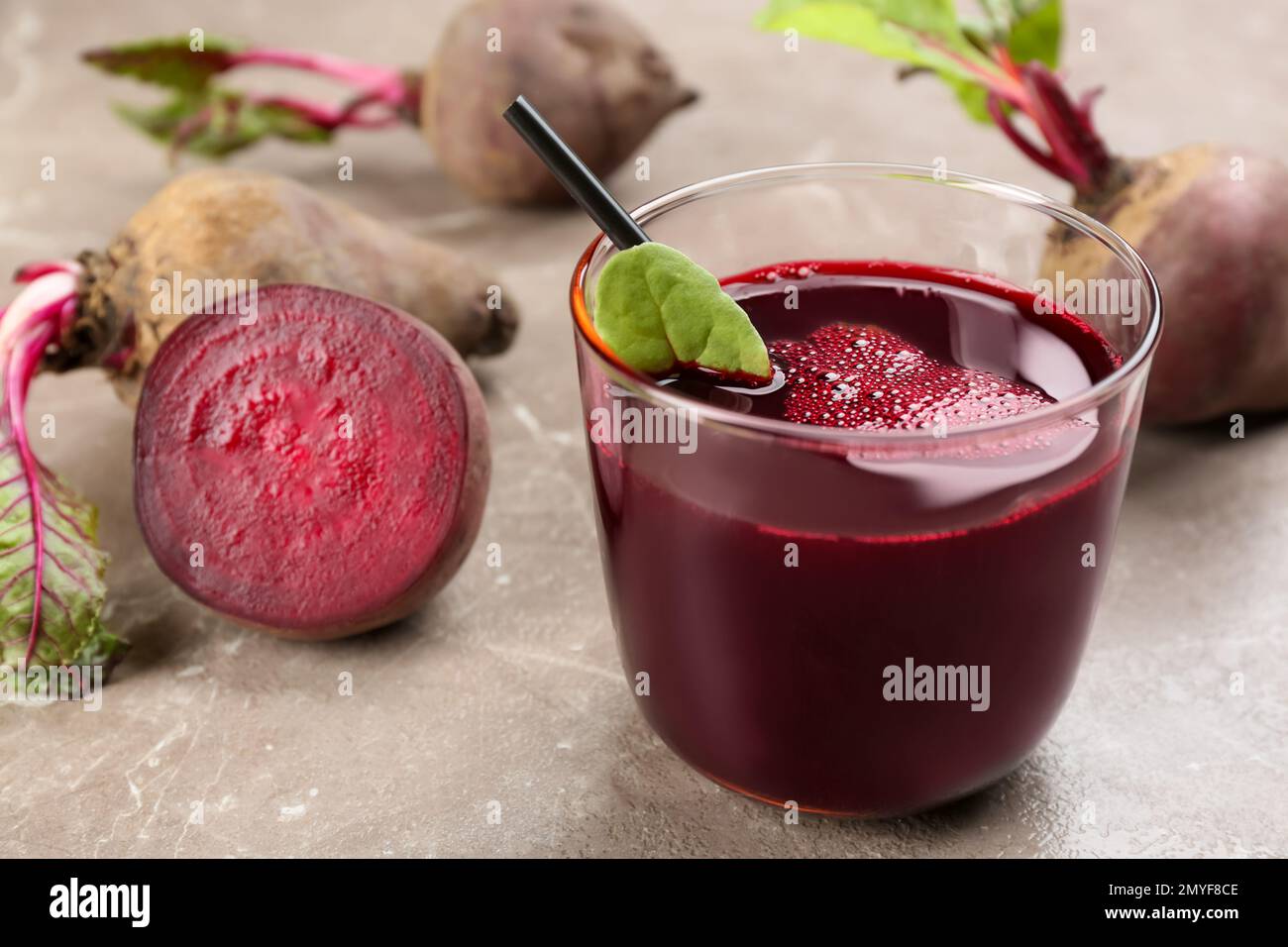 Freshly made beet juice on grey table Stock Photo