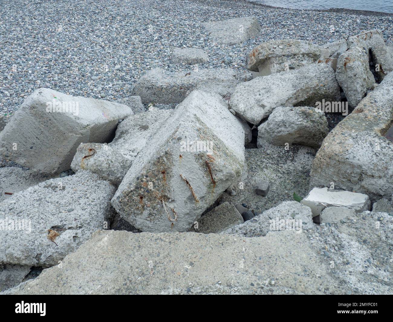 A pile of broken concrete. Cement lumps. Building material on the