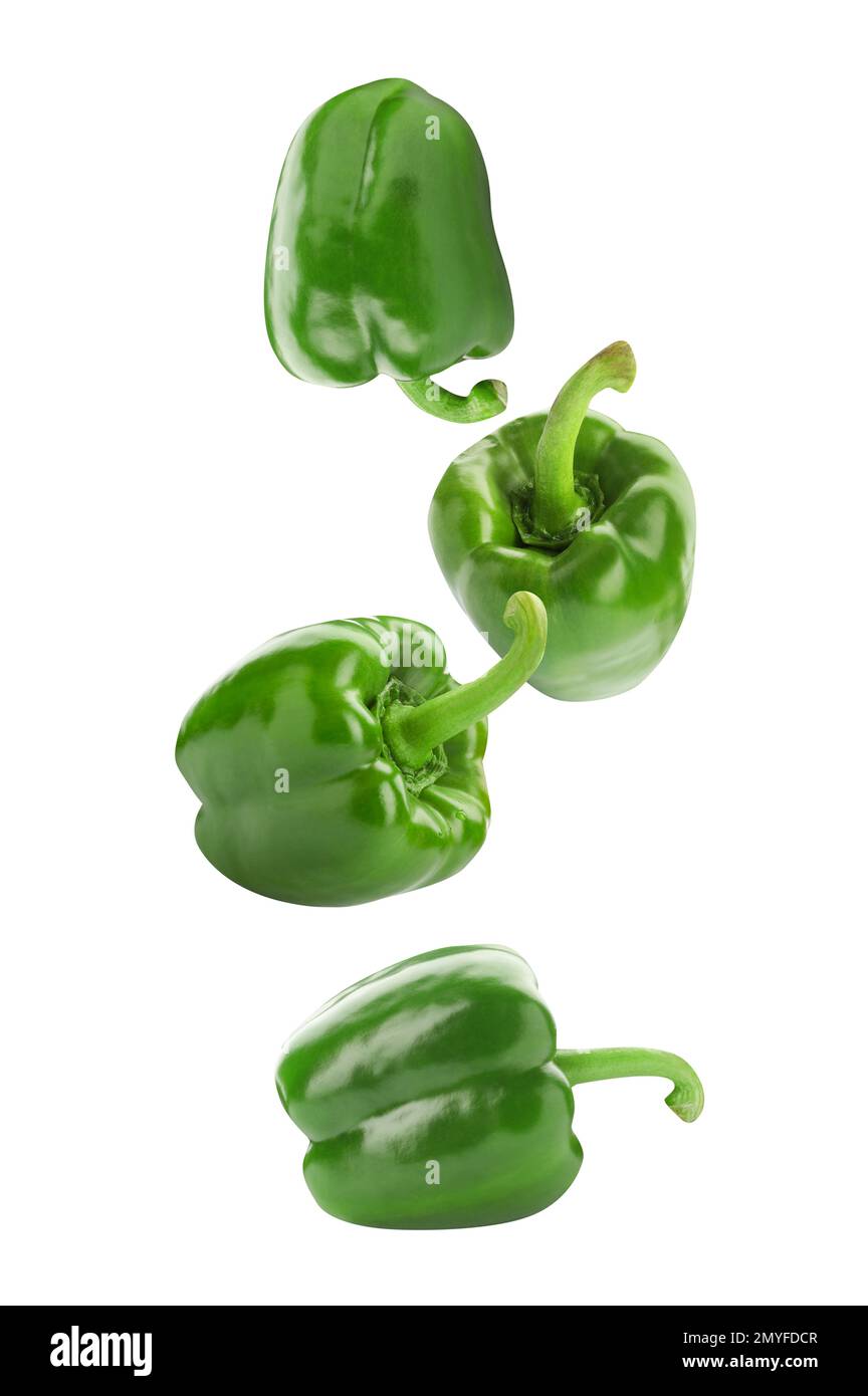 Fresh green bell peppers falling on white background Stock Photo Alamy