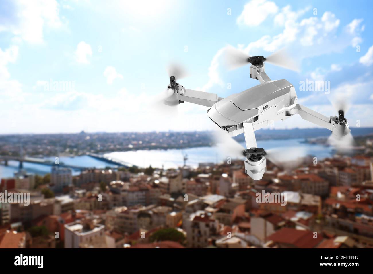 Modern drone flying over city. Aerial survey Stock Photo