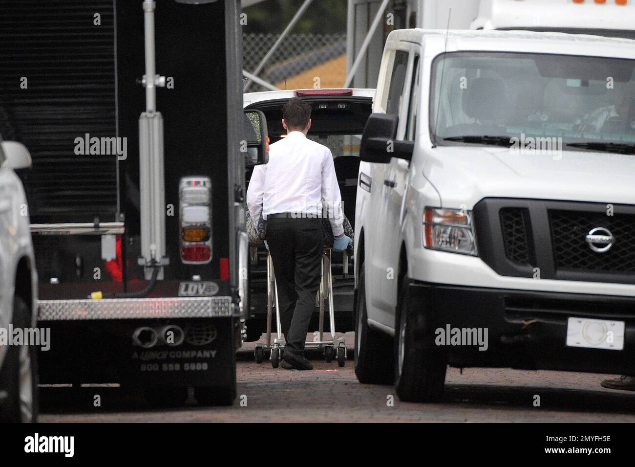 A body is loaded into a van outside the Pulse nightclub after a ...