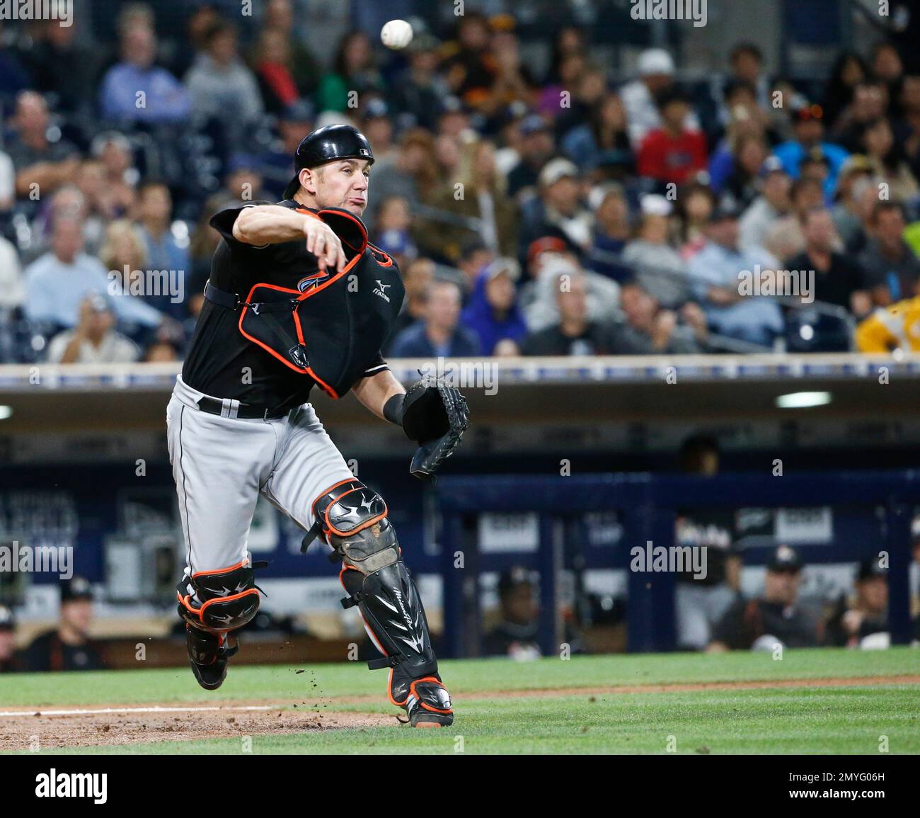 Miami Marlins catcher Jeff Mathis throws to first to put out San
