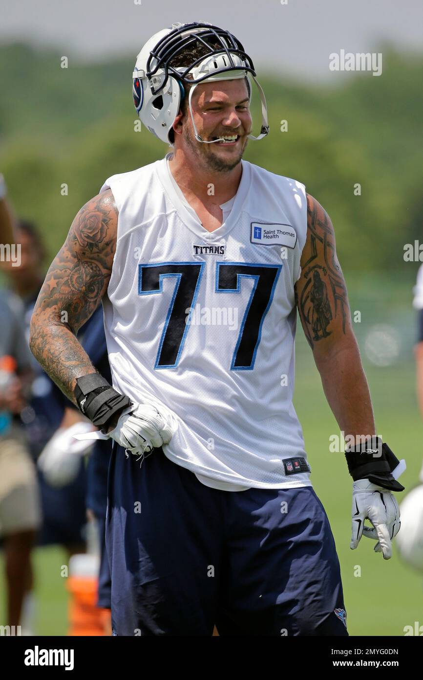 Tennessee Titans tackle Taylor Lewan (77) warms up during training camp at  the NFL football team's practice facility Wednesday, July 27, 2022, in  Nashville, Tenn. (AP Photo/Mark Humphrey Stock Photo - Alamy