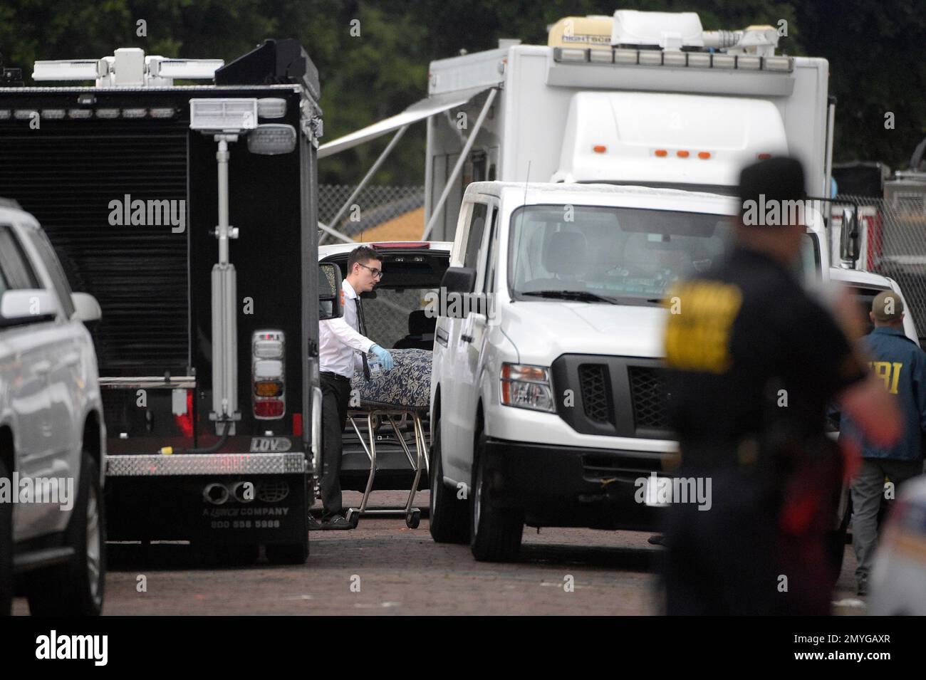 A body is loaded into a van outside the Pulse nightclub after a ...