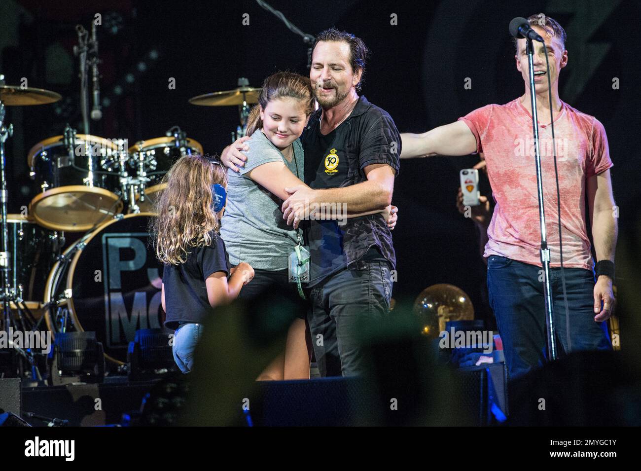 Harper Vedder, from left, Olivia Vedder, and Eddie Vedder of Pearl Jam