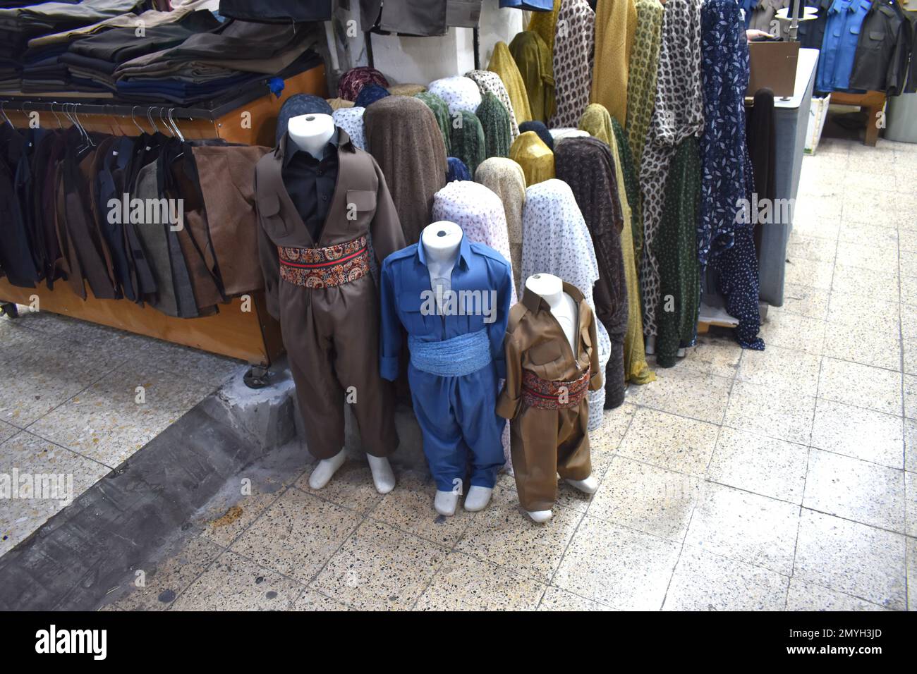 Traditional Kurdish outfits for sale in the souq (market), Duhok, Northern Iraq Stock Photo