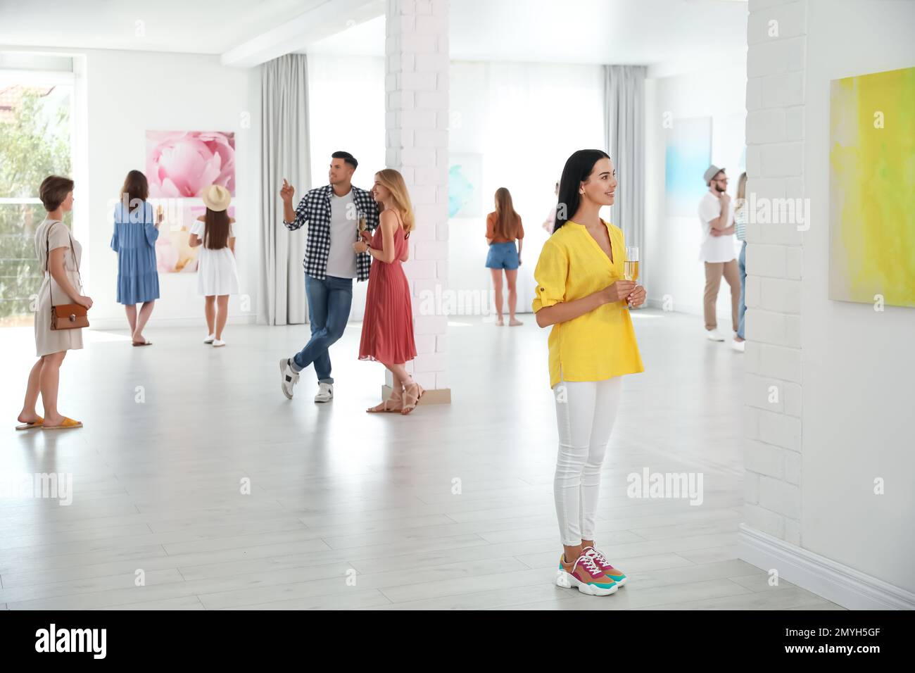 Group of people at exhibition in art gallery Stock Photo - Alamy