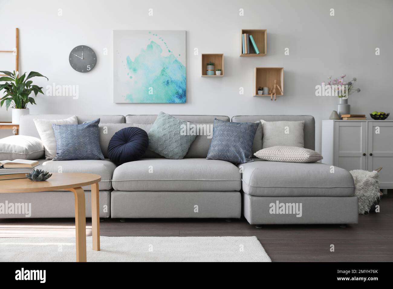 Elegant living room with comfortable sofa and wooden table. Interior ...
