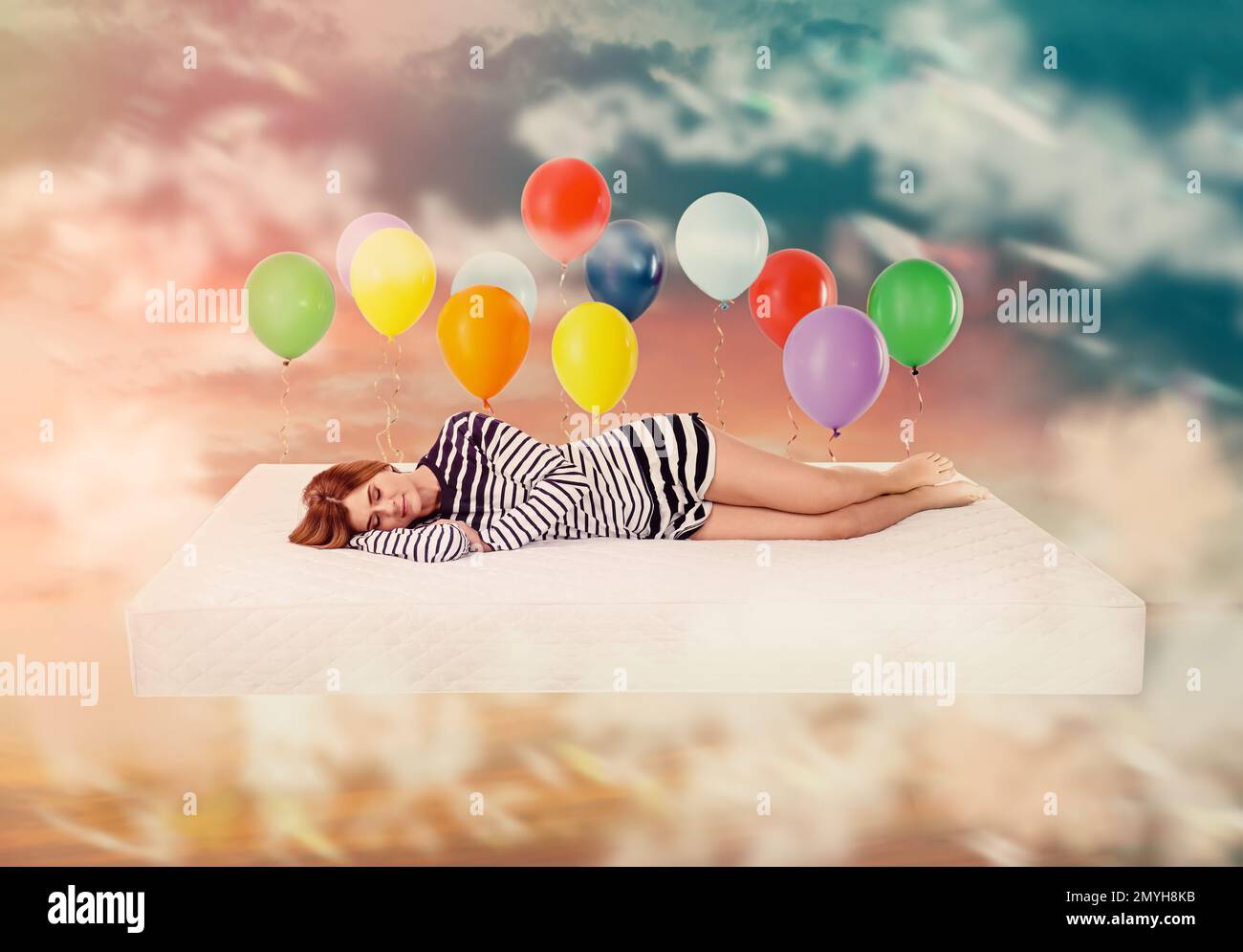 Sweet dreams. Bright cloudy sky with air balloons around sleeping woman ...