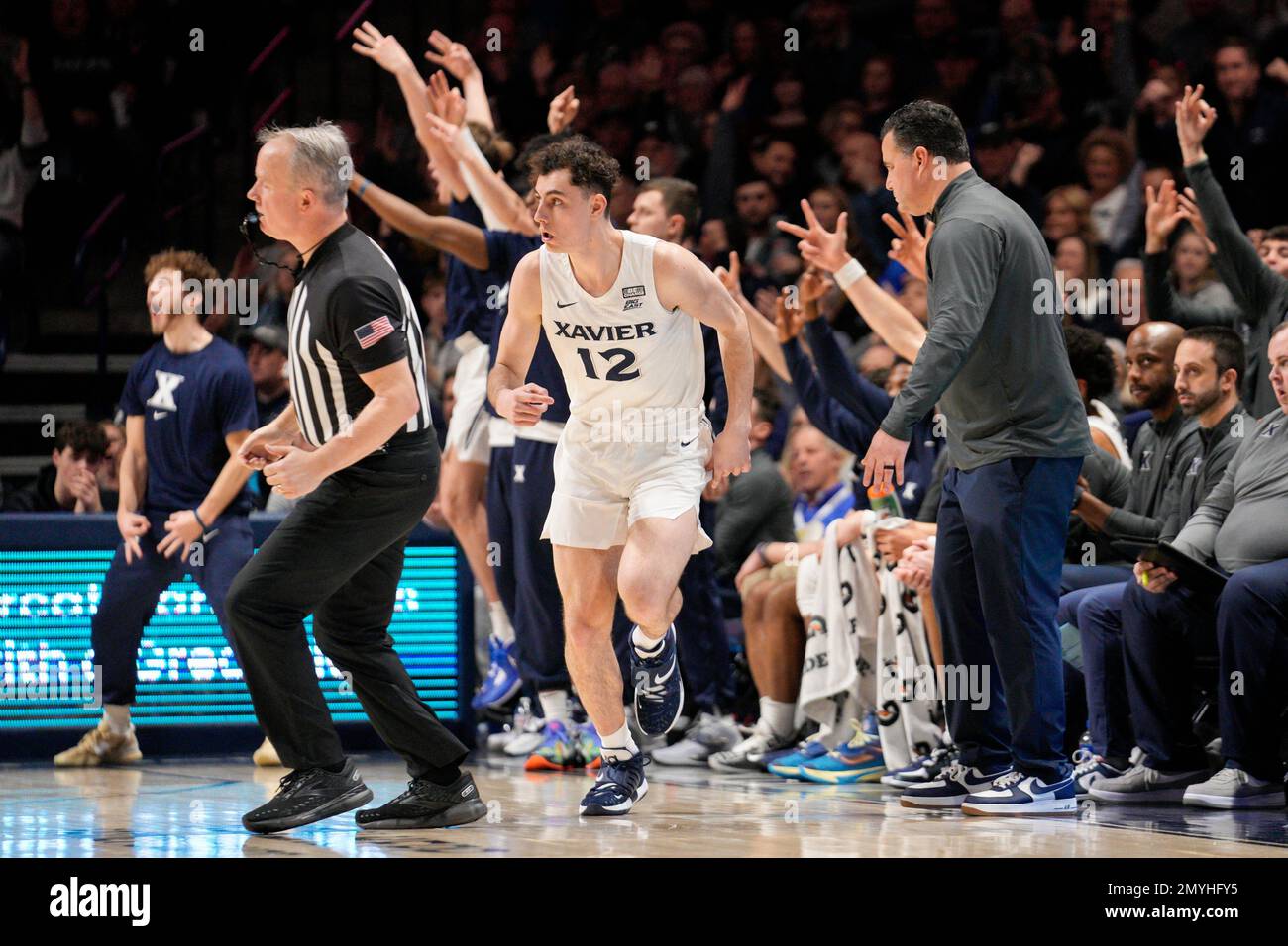 The Xavier bench reacts after a Kam Craft (12) 3point basket during