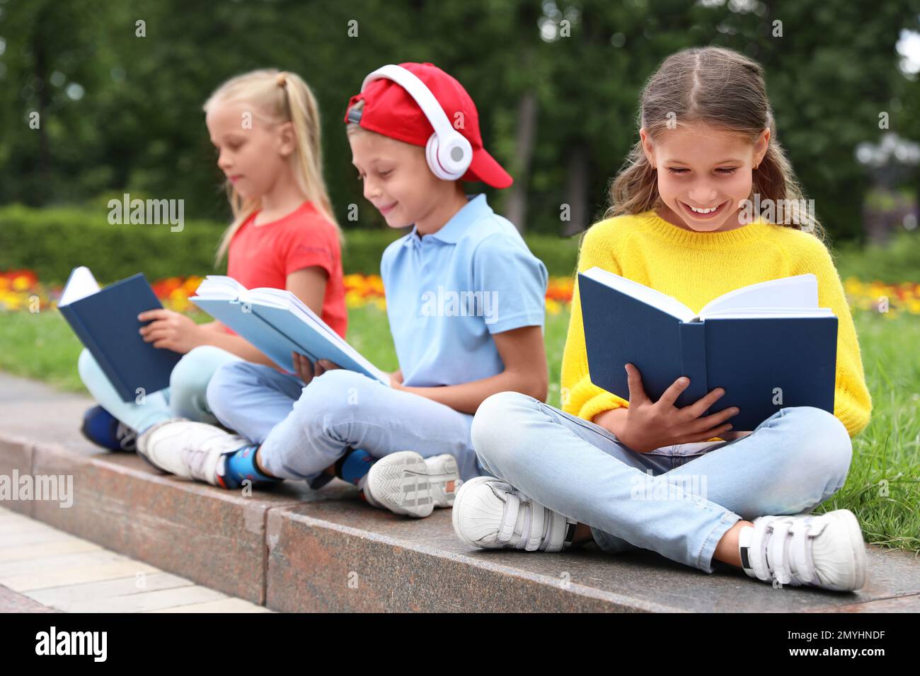 group-of-kids-reading-books-on-street-stock-photo-alamy