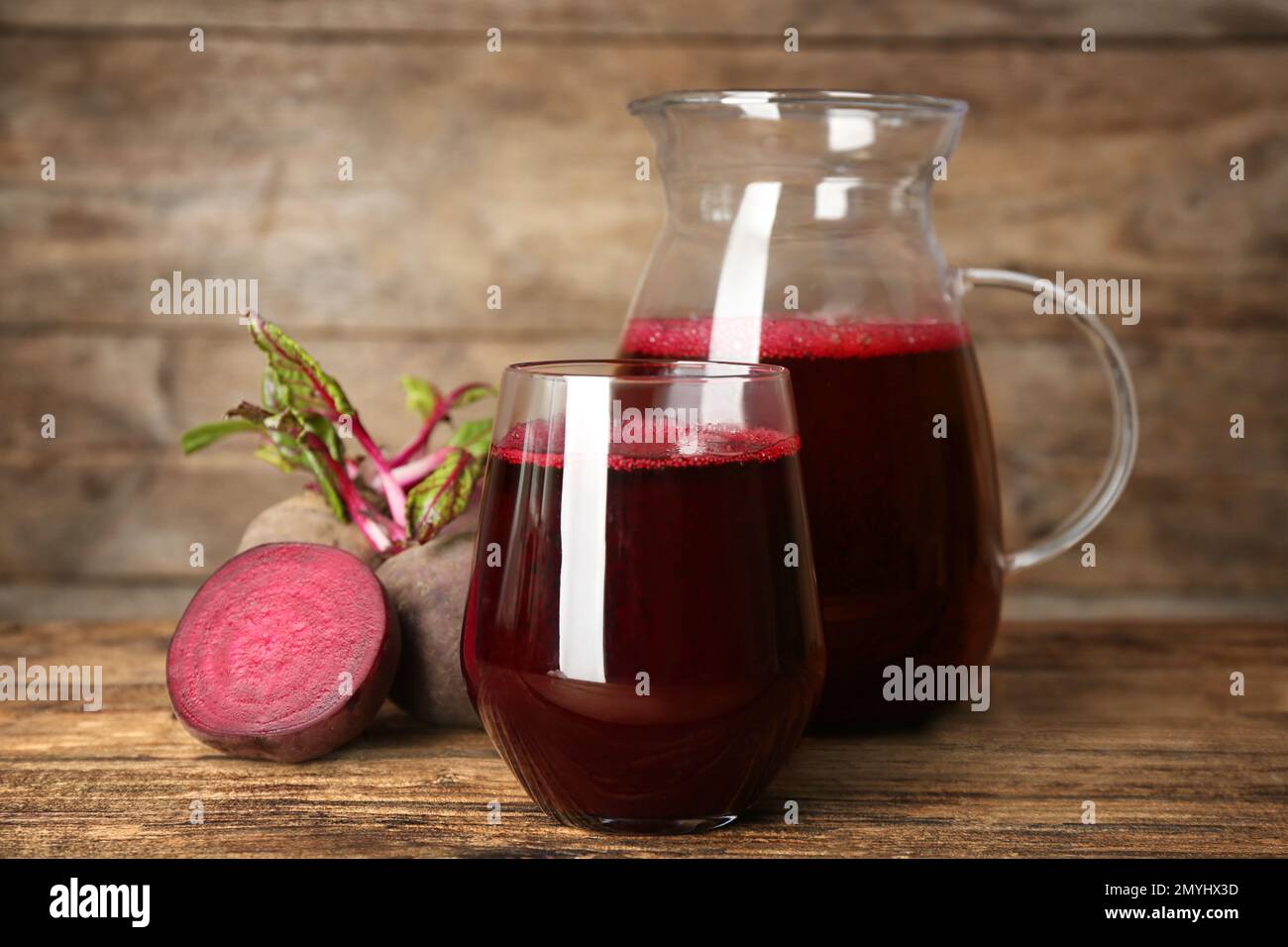 Freshly made beet juice on wooden table Stock Photo