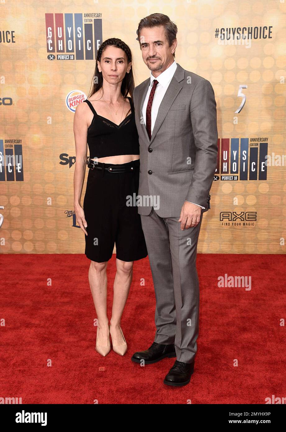 Tharita Cesaroni, left, and Dermot Mulroney arrives at the Guys Choice Awards at Sony Pictures
