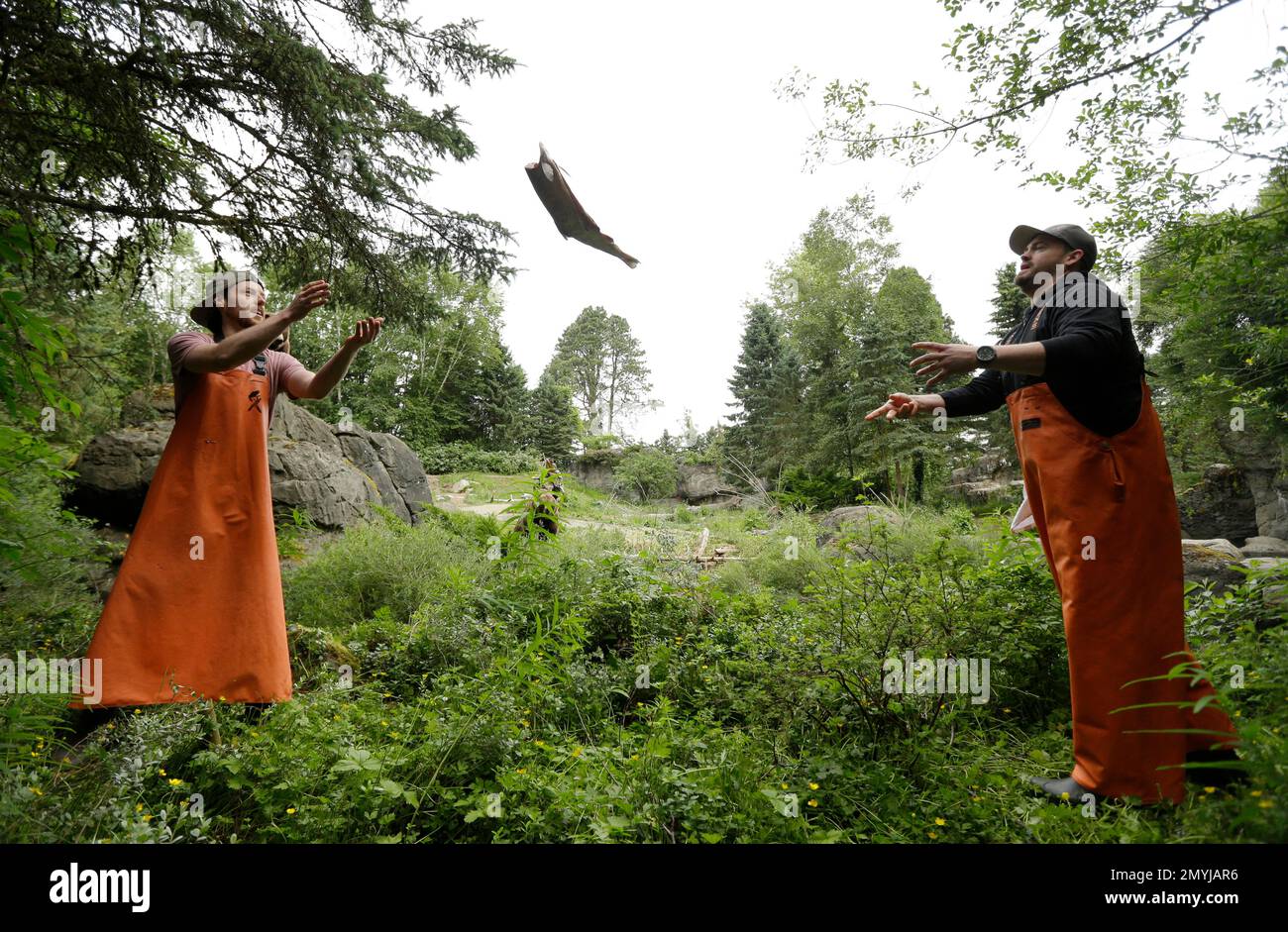 Fishmongering C.J. Conrad, left, and Ryan Dehn, right, fishmongers from Pike Place ...