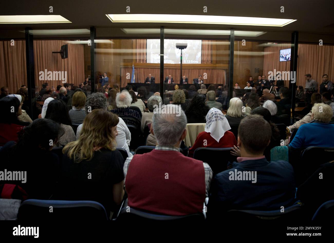 People sit federal court for the sentencing of former military officers