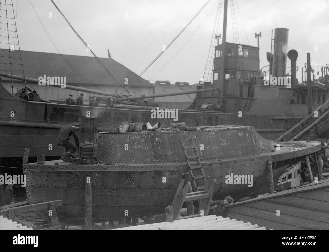 A fishing craft in the background dwarfs the smallest all steel vessel
