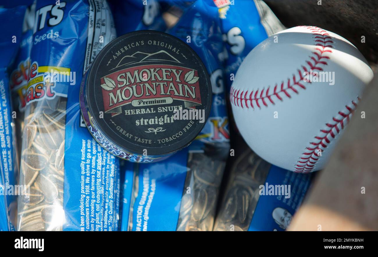 Nicotine free chewing tobacco and sunflower seeds are seen in the  Washington Nationals dugout prior to the start of a baseball game against  the New York Mets at Nationals Park, Wednesday, May