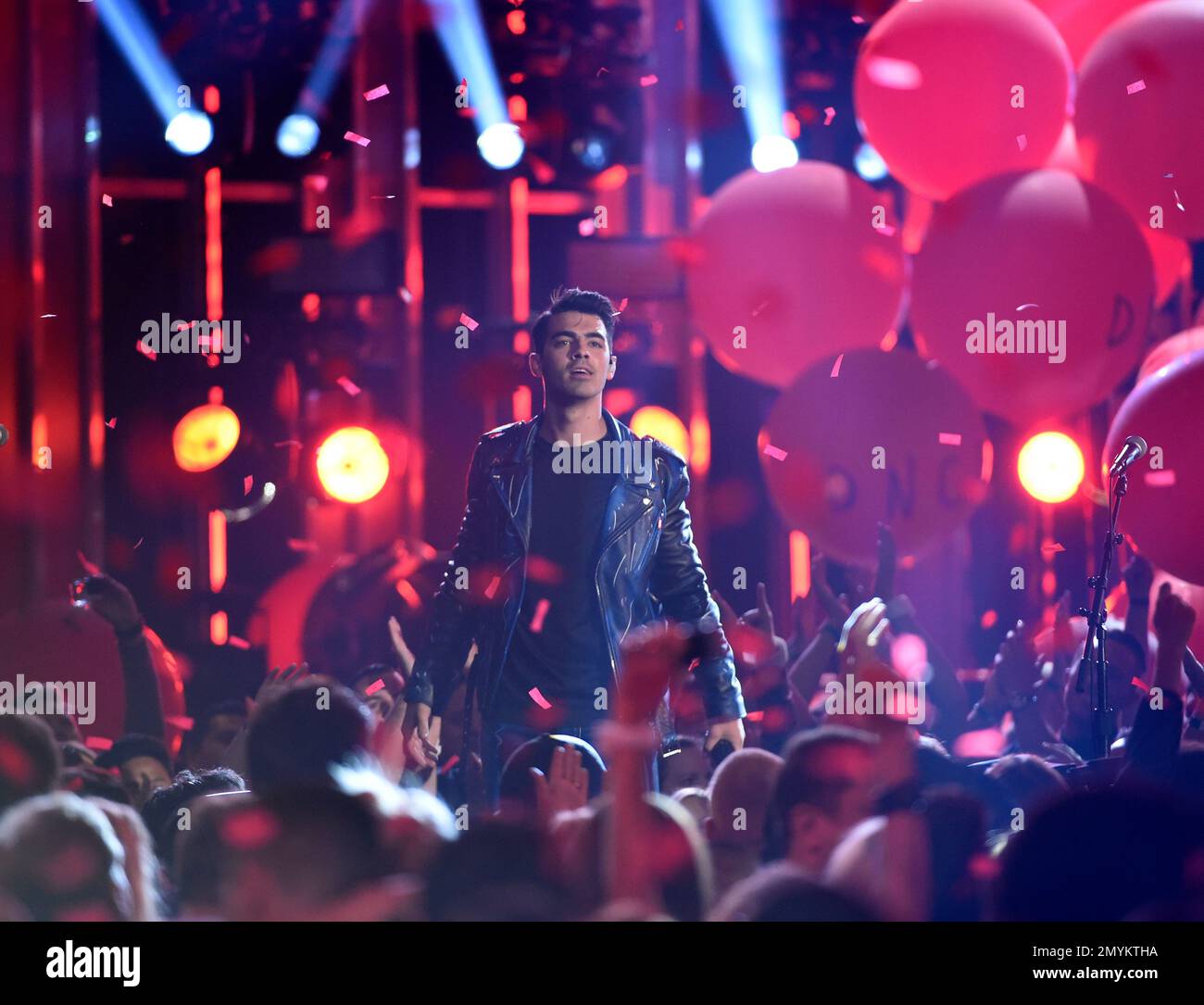 Joe Jonas, of DNCE, performs “Cake By The Ocean” at the Billboard Music